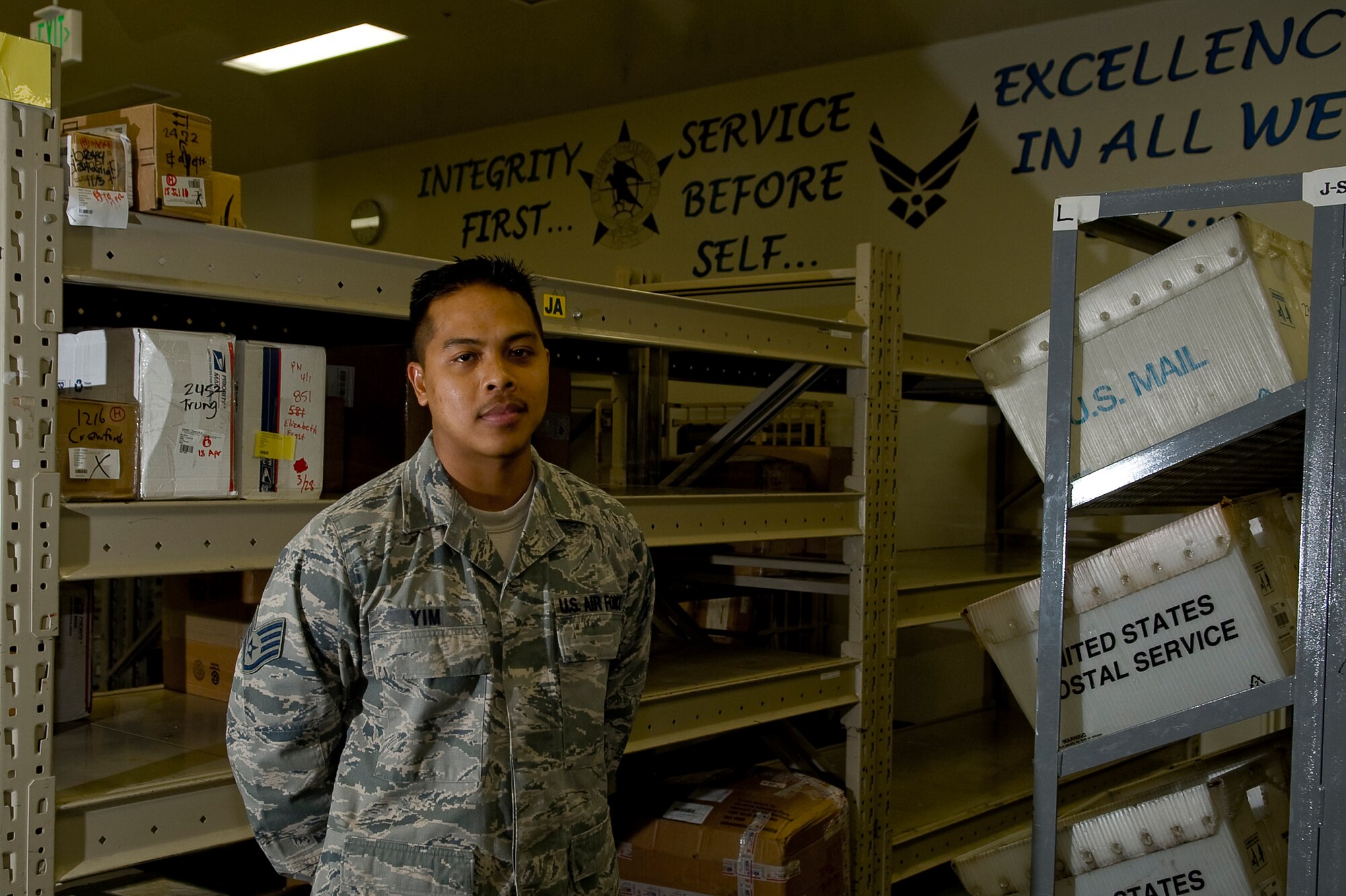 YOKOTA AIR BASE, Japan -- U.S. Air Force Staff Sgt. Phuong Yim, 374th Communications Squadron, works as a Postal Technician at Yokota Air Base, April 2, 2011. When asked how he is supporting Operation Tomodachi, the Lynn, Mass. native replied, “We continue to do our part so that people who have their hands in the action can continue to do what they do best.” (U.S. Air Force photo by/Master Sgt. Jeromy K. Cross)