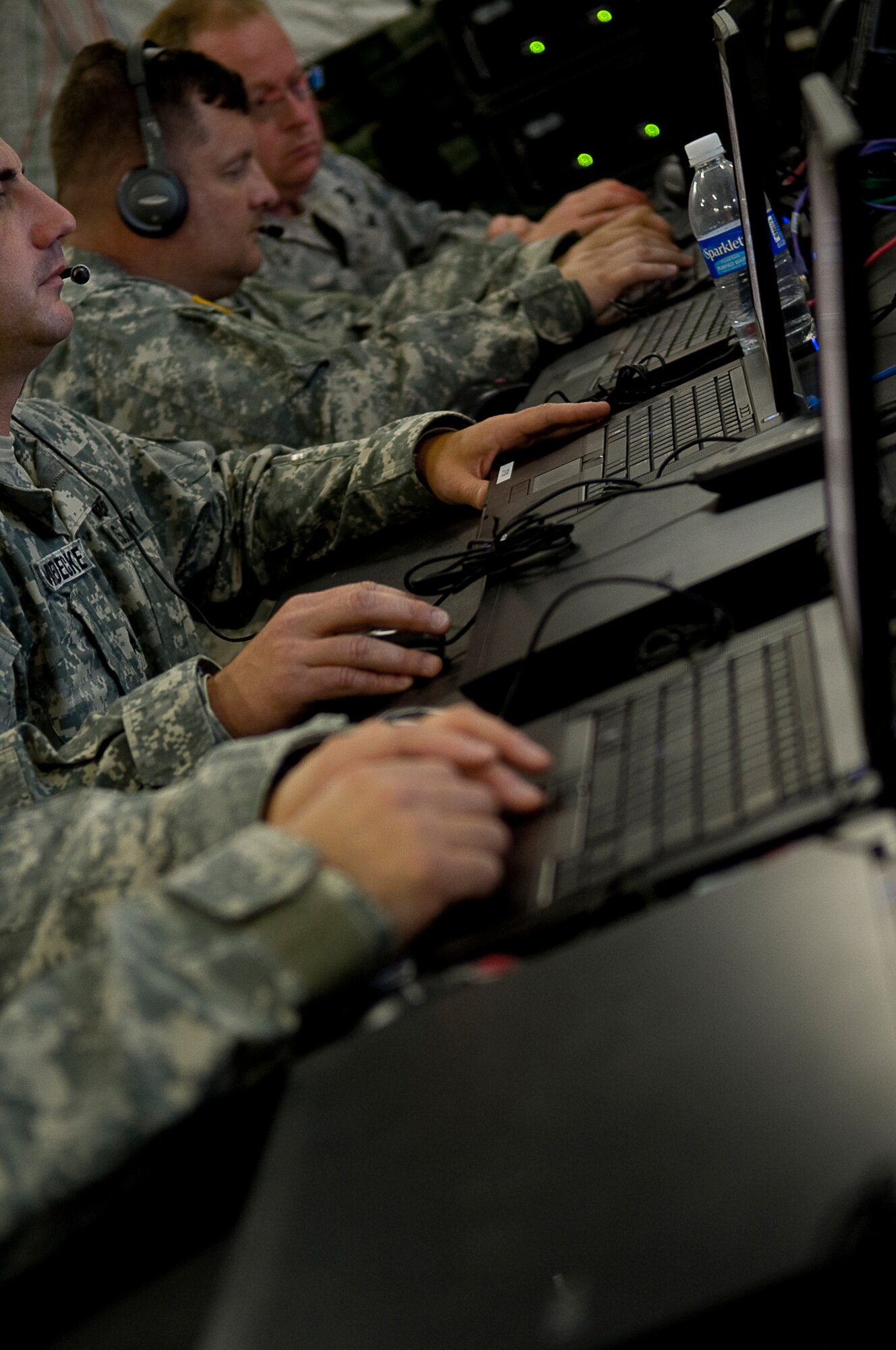 YOKOTA AIR BASE, Japan -- Soldiers, Sailors, Airmen and Marines, use computers provided by the Deployable Joint Command and Control System (DJC2) at Yokota Air Base, Japan April 1. The DJC2 is deployed to Yokota to provide communications in support of Operation Tomodachi (U.S. Air Force photo/Master Sgt. Jeromy K. Cross)















