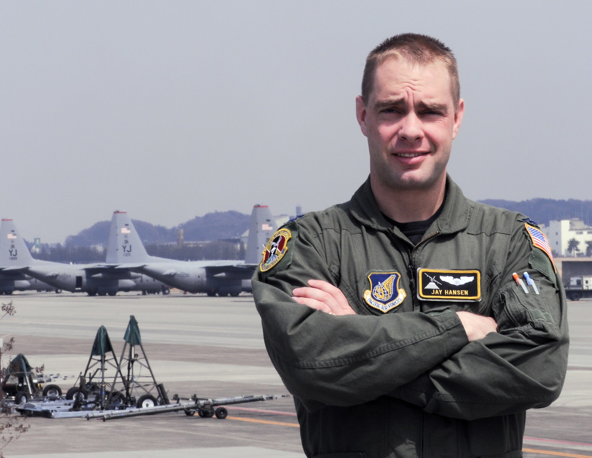 YOKOTA AIR BASE, Japan -- Capt. Jay Hansen, 36th Airlift Squadron pilot, stands on the flightline at Yokota Air Base, Japan, April 2, 2011. Captain Hansen, a native of Monteview, Idaho, has been flying humanitarian aid supplies to help Japan after the earthquake and tsunami. "It is an honor to represent our country around the world and very satisfying to use the training I've been given to help my fellow man," said Captain Hansen. (U.S. Air Force photo/Airman 1st Class Krystal M. Garrett) 