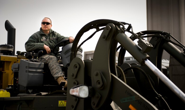 SENDAI AIRPORT, Japan -- Tech. Sgt. Michael Fletcher, 353rd Special Operations Group NCO in charge of air transportation team, sits on a forklift at Sendai Airport, Japan, March 20, 2011. (U.S. Air Force photo/Staff Sgt. Samuel Morse)