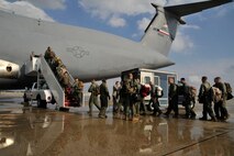 Marines from II Marine Expeditionary Force, Chemical Biological Incident Response Force, Initial Response Force 'A' board a C-5 Galaxy bound for Japan, April. 1 2011 at Joint Base Andrews, Md. The Marine unit is specially trained to counter the effects of a chemical, biological, radiological, nuclear or high-yeild explosive (CBRNE) incident. Will Provide the U.S. on-scene commander a rapid response capability and, if requested, [allow the commander to] assist Japanese authorities by providing advice and expertise in the areas of agent detection and identification, casualty search and rescue, personnel decontamination and emergency medical care. This is CBIRF's first  overseas deployment since it was stood up in 1996 in response to the sarin attack on Tokyo subway in 1995. (Released)