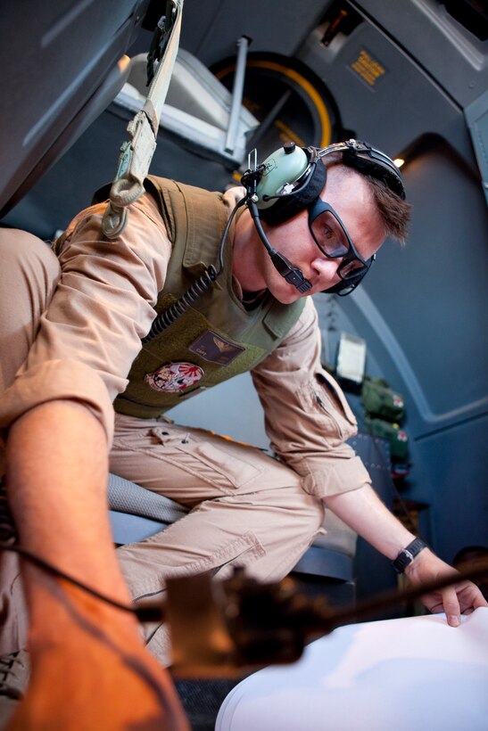 Capt. Mclean Irvan, a KC-130J Hercules pilot with Marine Aerial Refueler Transport Squadron 252 reviews maps during a flight to Naval Support Activity Souda Bay, Greece, April 3. Marines planned and coordinated for more than one month in preparation for the mission to return Marine Medium Tiltrotor Squadron 266 to the USS Kearsarge, 26th Marine Expeditionary Unit, after a deployment in support of operations in Afghanistan.