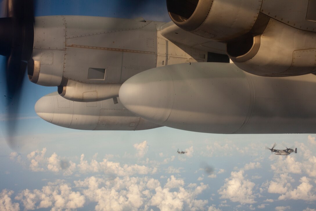 Two MV-22B Osprey's with Marine Medium Tiltrotor Squadron 266 fly in formation alongside a KC-130J Hercules, with Marine Aerial Refueler Transport Squadron 252  en route to Naval Support Activity Souda Bay, Greece, April 3 . Marines planned and coordinated for more than one month in preparation for VMM-266's return flight to the USS Kearsarge, 26th Marine Expeditionary Unit, after a deployment in support of operations in Afghanistan.
