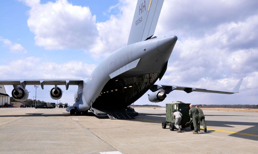 MISAWA AIR BASE, Japan – Airmen load a power generator onboard a U.S. Air Force C-17 Globemaster III assigned to Hickam Air Force Base, Hawaii, at the flightline here April 2. The aircraft, flown by members of the 517th Airlift Squadron assigned to Joint Base Elmendorf-Richardson, Alaska, took 15 generators to Yokota Air Base, Japan, in support of Operation Tomodachi. (U.S. Air Force photo by Senior Airman Joe McFadden/Released)