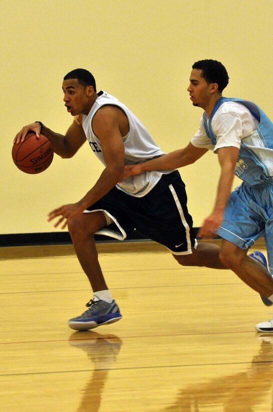 The Air Force basketball team (white) scrimmages the American Basketball Associations Minnesota Blizzards (blue) at the Minneapolis-St. Paul International Airport Air Reserve Station, Minn., April 2 2011. (Air Force Photo/TSgt Bob Sommer)