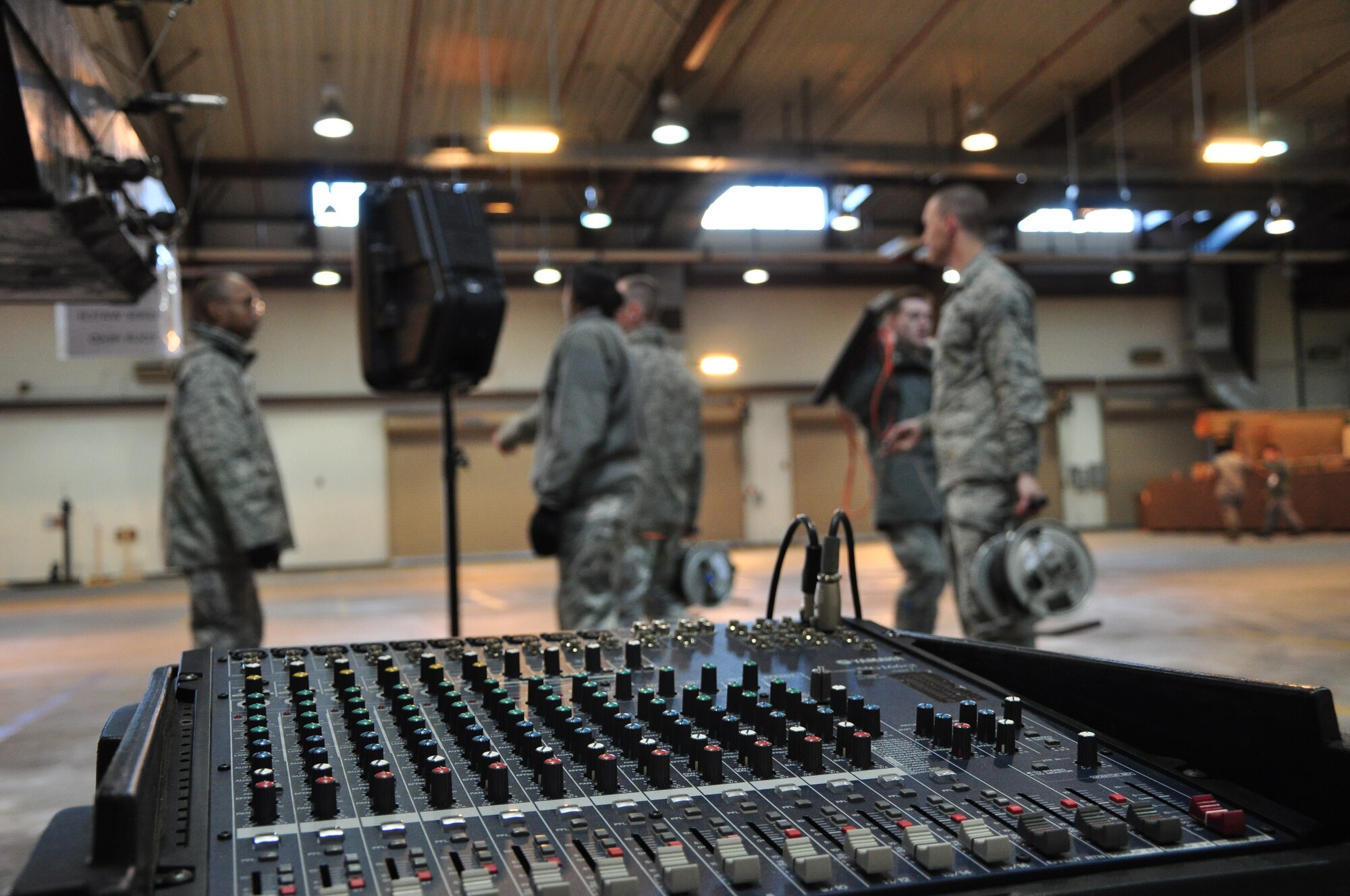 Airmen with the 51st Communications Squadron set up some speakers and audio equipment for a commander's call here March 25. The 51st CS proved it was one of the best squadrons in the Air Force in 2010 by winning several major command-level Air Force awards. (U.S. Air Force photo/Staff Sgt. Chad Thompson)