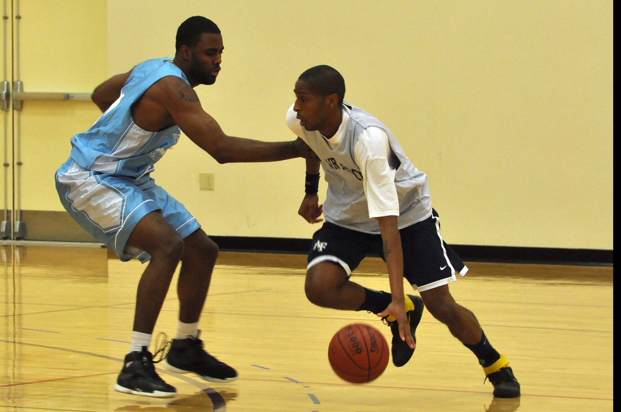 The Air Force basketball team (white) scrimmages the American Basketball Associations Minnesota Blizzards (blue) at the Minneapolis-St. Paul International Airport Air Reserve Station, Minn., April 2 2011. (Air Force Photo/TSgt Bob Sommer)