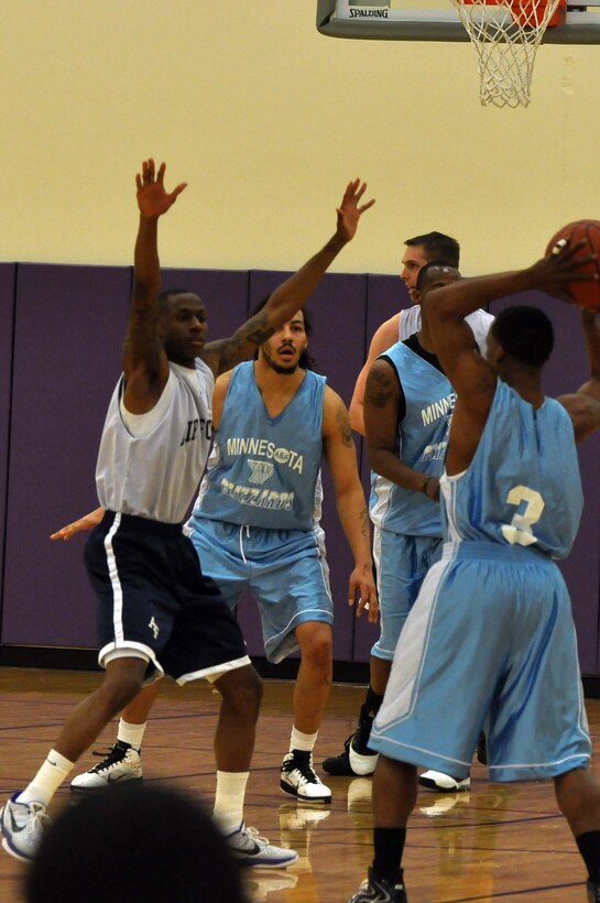 The Air Force basketball team (white) scrimmages the American Basketball Associations Minnesota Blizzards (blue) at the Minneapolis-St. Paul International Airport Air Reserve Station, Minn., April 2 2011. (Air Force Photo/TSgt Bob Sommer)