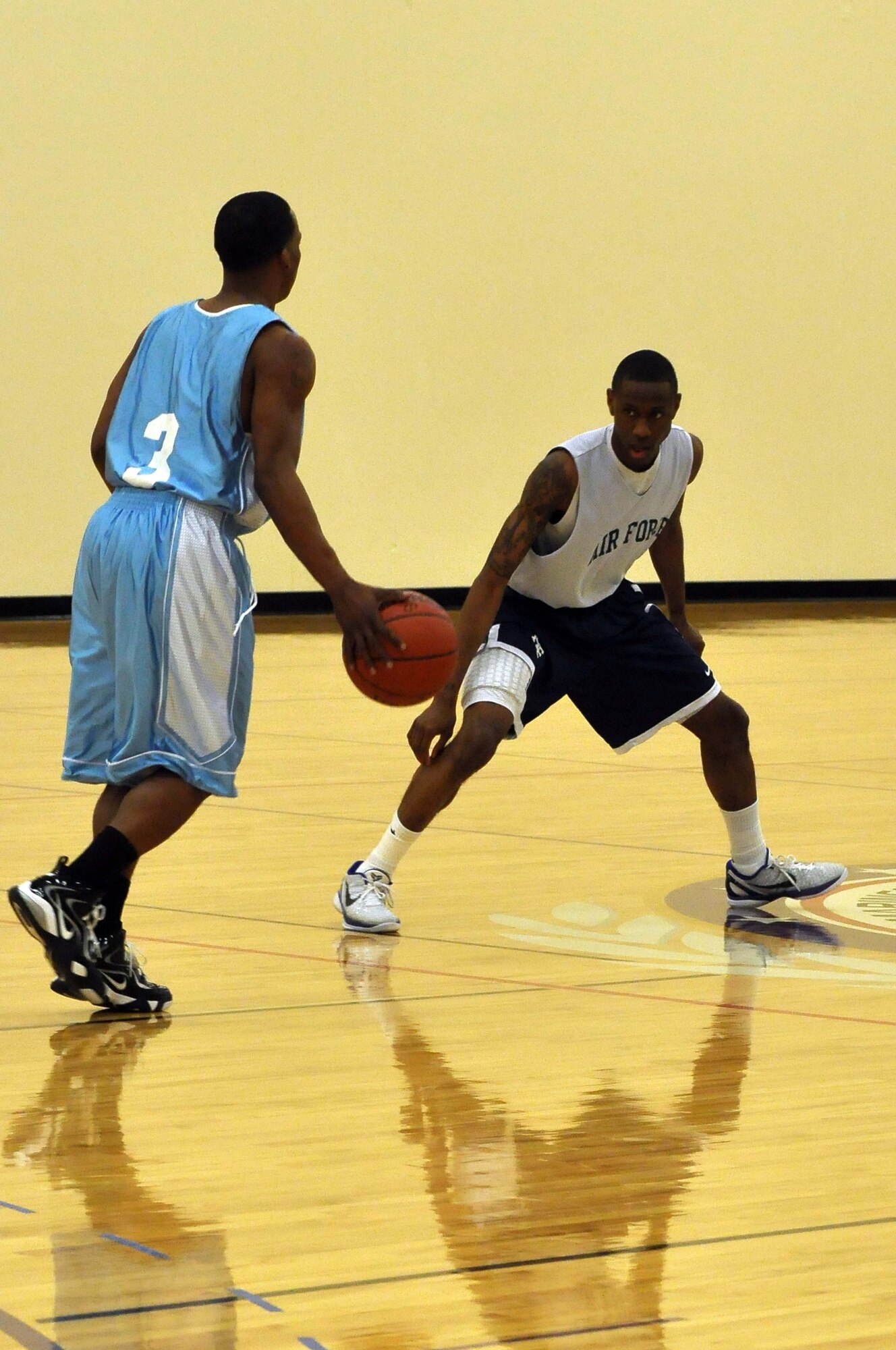 The Air Force basketball team (white) scrimmages the American Basketball Associations Minnesota Blizzards (blue) at the Minneapolis-St. Paul International Airport Air Reserve Station, Minn., April 2 2011. (Air Force Photo/TSgt Bob Sommer)