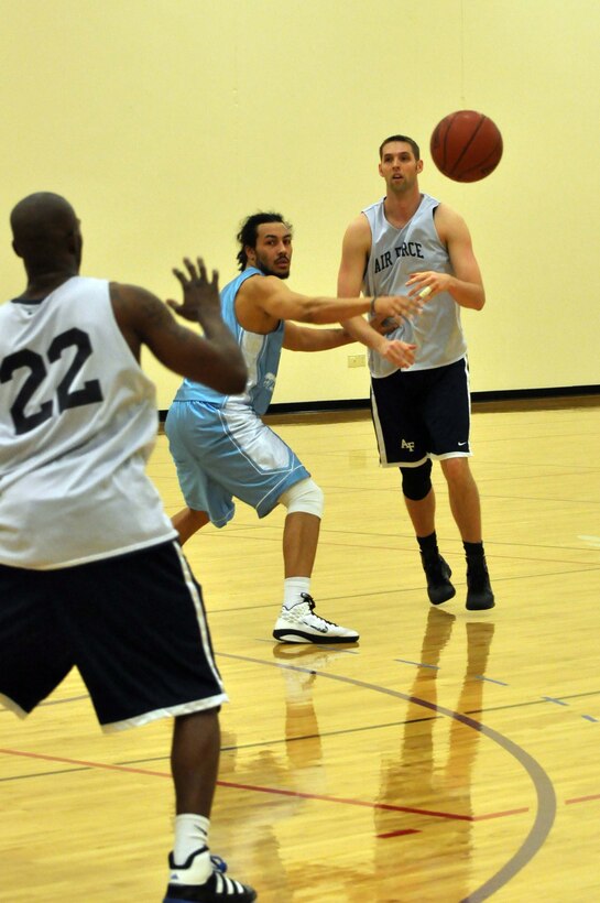 The Air Force basketball team (white) scrimmages the American Basketball Associations Minnesota Blizzards (blue) at the Minneapolis-St. Paul International Airport Air Reserve Station, Minn., April 2 2011. (Air Force Photo/TSgt Bob Sommer)