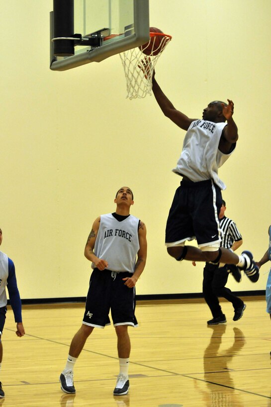 The Air Force basketball team (white) scrimmages the American Basketball Associations Minnesota Blizzards (blue) at the Minneapolis-St. Paul International Airport Air Reserve Station, Minn., April 2 2011. (Air Force Photo/TSgt Bob Sommer)