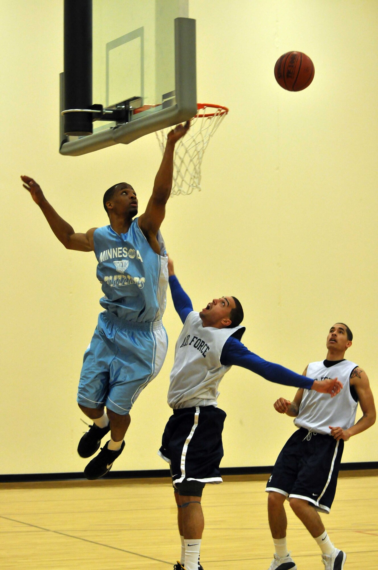 The Air Force basketball team (white) scrimmages the American Basketball Associations Minnesota Blizzards (blue) at the Minneapolis-St. Paul International Airport Air Reserve Station, Minn., April 2 2011. (Air Force Photo/TSgt Bob Sommer)