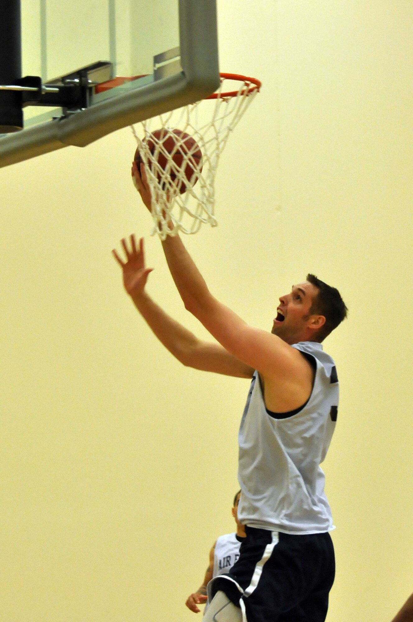 The Air Force basketball team (white) scrimmages the American Basketball Associations Minnesota Blizzards (blue) at the Minneapolis-St. Paul International Airport Air Reserve Station, Minn., April 2 2011. (Air Force Photo/TSgt Bob Sommer)