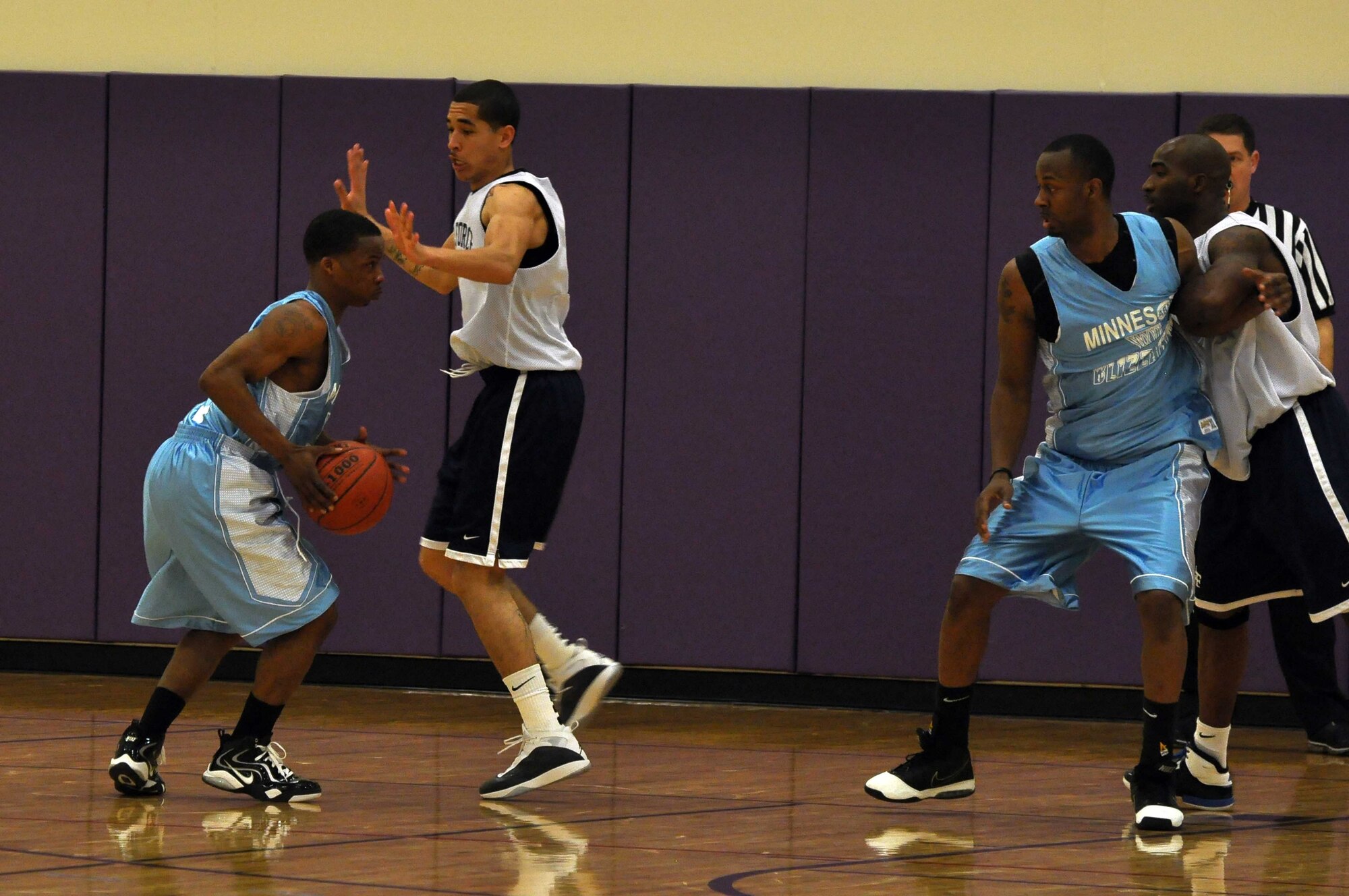 The Air Force basketball team (white) scrimmages the American Basketball Associations Minnesota Blizzards (blue) at the Minneapolis-St. Paul International Airport Air Reserve Station, Minn., April 2 2011. (Air Force Photo/TSgt Bob Sommer)