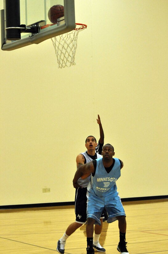 The Air Force basketball team (white) scrimmages the American Basketball Associations Minnesota Blizzards (blue) at the Minneapolis-St. Paul International Airport Air Reserve Station, Minn., April 2 2011. (Air Force Photo/TSgt Bob Sommer)