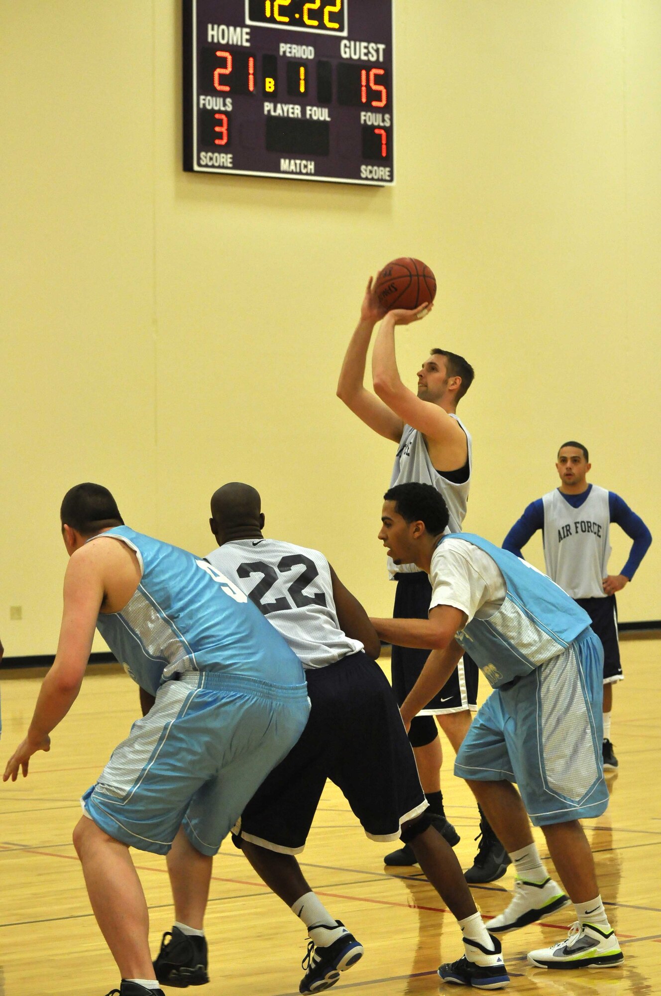 The Air Force basketball team (white) scrimmages the American Basketball Associations Minnesota Blizzards (blue) at the Minneapolis-St. Paul International Airport Air Reserve Station, Minn., April 2 2011. (Air Force Photo/TSgt Bob Sommer)