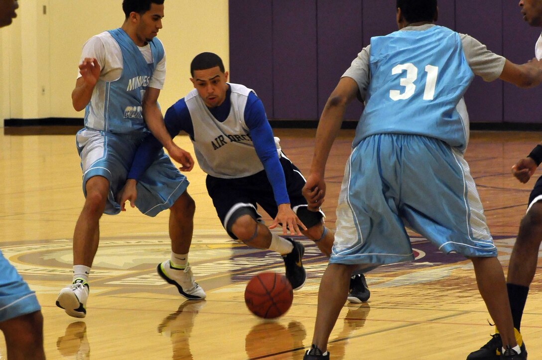 The Air Force basketball team (white) scrimmages the American Basketball Associations Minnesota Blizzards (blue) at the Minneapolis-St. Paul International Airport Air Reserve Station, Minn., April 2 2011. (Air Force Photo/TSgt Bob Sommer)