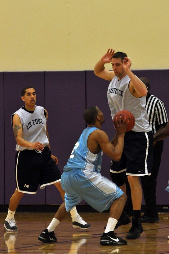 The Air Force basketball team (white) scrimmages the American Basketball Associations Minnesota Blizzards (blue) at the Minneapolis-St. Paul International Airport Air Reserve Station, Minn., April 2 2011. (Air Force Photo/TSgt Bob Sommer)