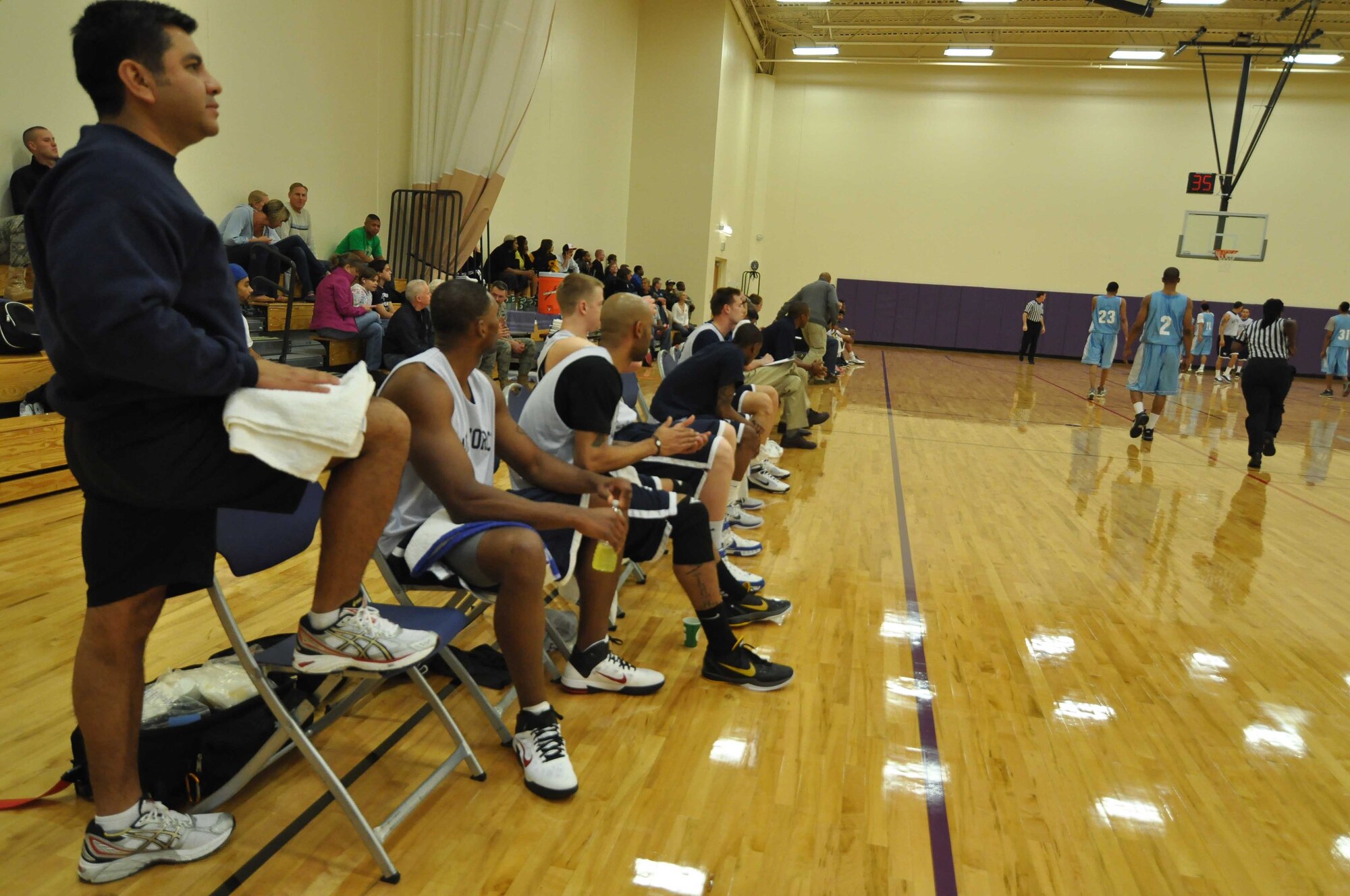The Air Force basketball team (white) scrimmages the American Basketball Associations Minnesota Blizzards (blue) at the Minneapolis-St. Paul International Airport Air Reserve Station, Minn., April 2 2011. (Air Force Photo/TSgt Bob Sommer)
