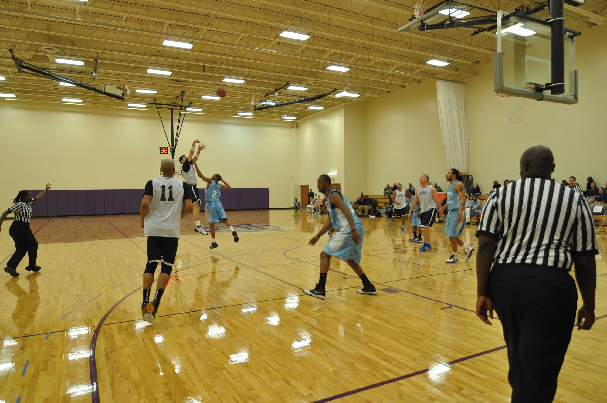 The Air Force basketball team (white) scrimmages the American Basketball Associations Minnesota Blizzards (blue) at the Minneapolis-St. Paul International Airport Air Reserve Station, Minn., April 2 2011. (Air Force Photo/TSgt Bob Sommer)