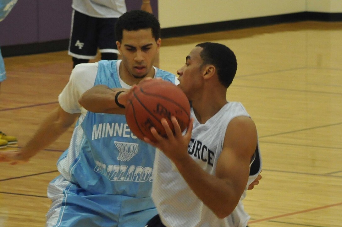 The Air Force basketball team (white) scrimmages the American Basketball Associations Minnesota Blizzards (blue) at the Minneapolis-St. Paul International Airport Air Reserve Station, Minn., April 2 2011. (Air Force Photo/TSgt Bob Sommer)