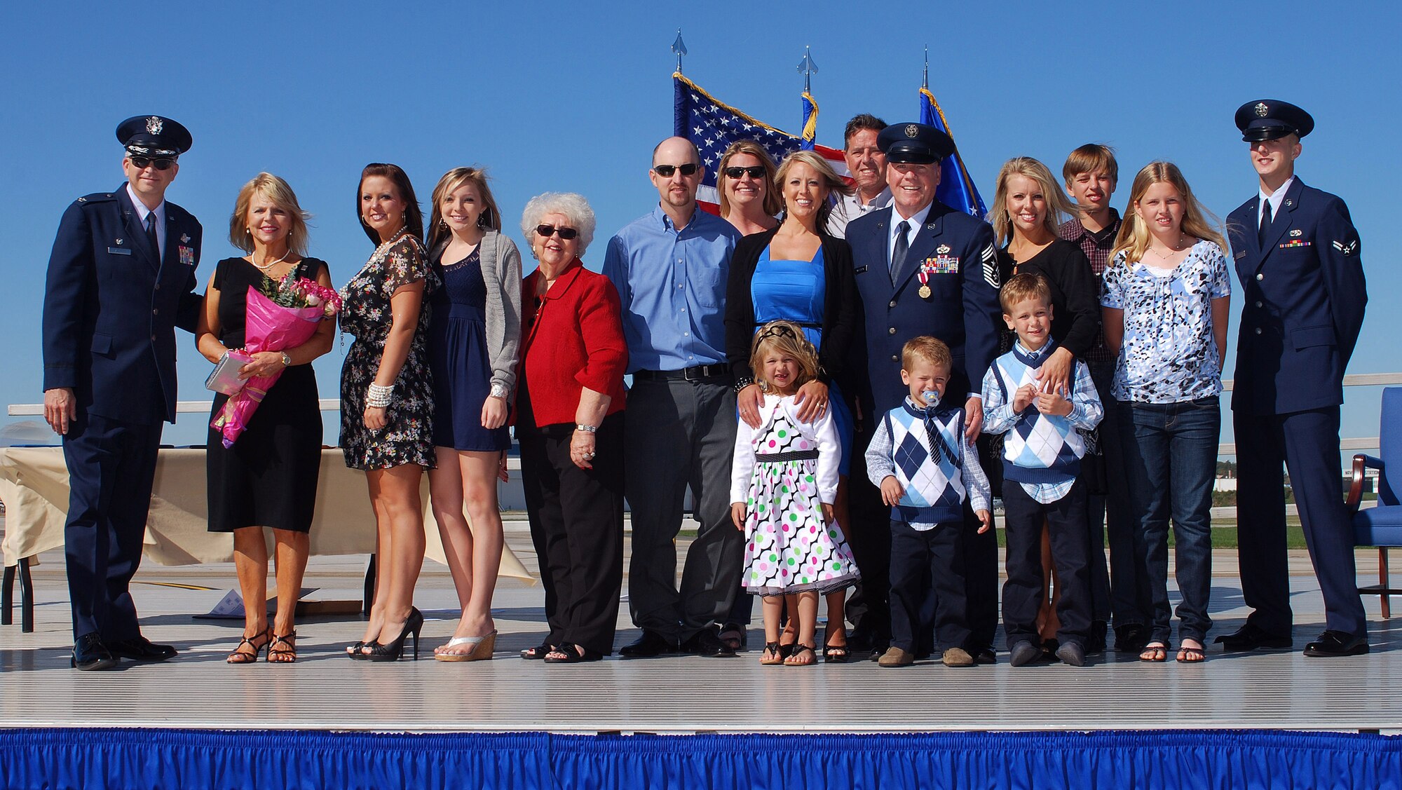Col. Timothy E. Tarchick, 94th Airlift Wing Commander, stands with the family of Chief Master Sgt John M. Anderson, 94th Airlift Wing Command Chief, on the day of his retirement, after 33 years of active and reserve Air Force duty, Apr 3.   (U.S. Air Force photo/ Brad Fallin)
