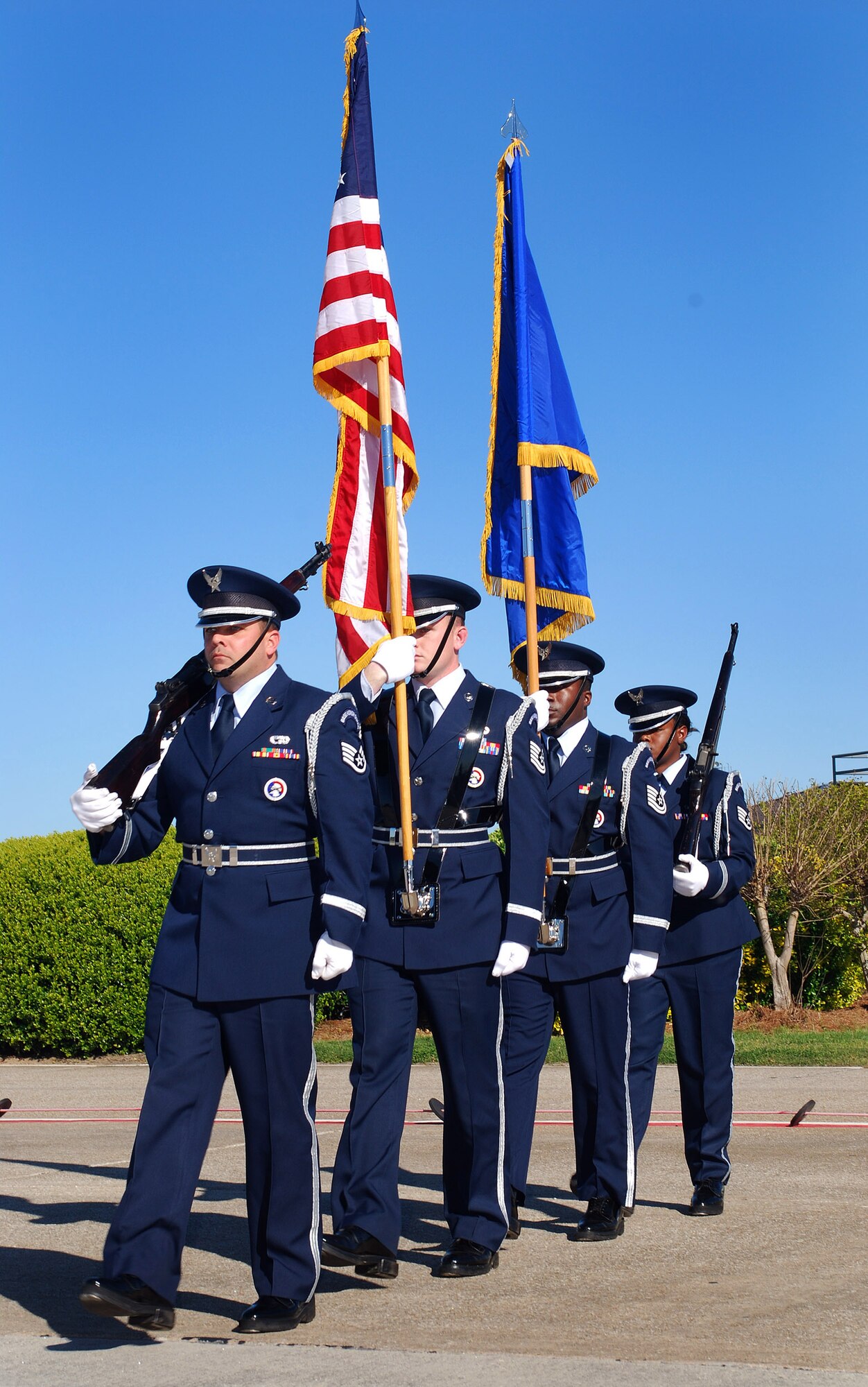 Members of the 94th Airlift Wing Honor Guard move in unison to post the colors for the 94th Airlift Wing Command Chief, Chief Master Sgt. John M. Anderson's retirement ceremony, Apr 3.  Chief Anderson retires after 33 years of active and reserve Air Force duty.   (U.S. Air Force photo/ Brad Fallin)