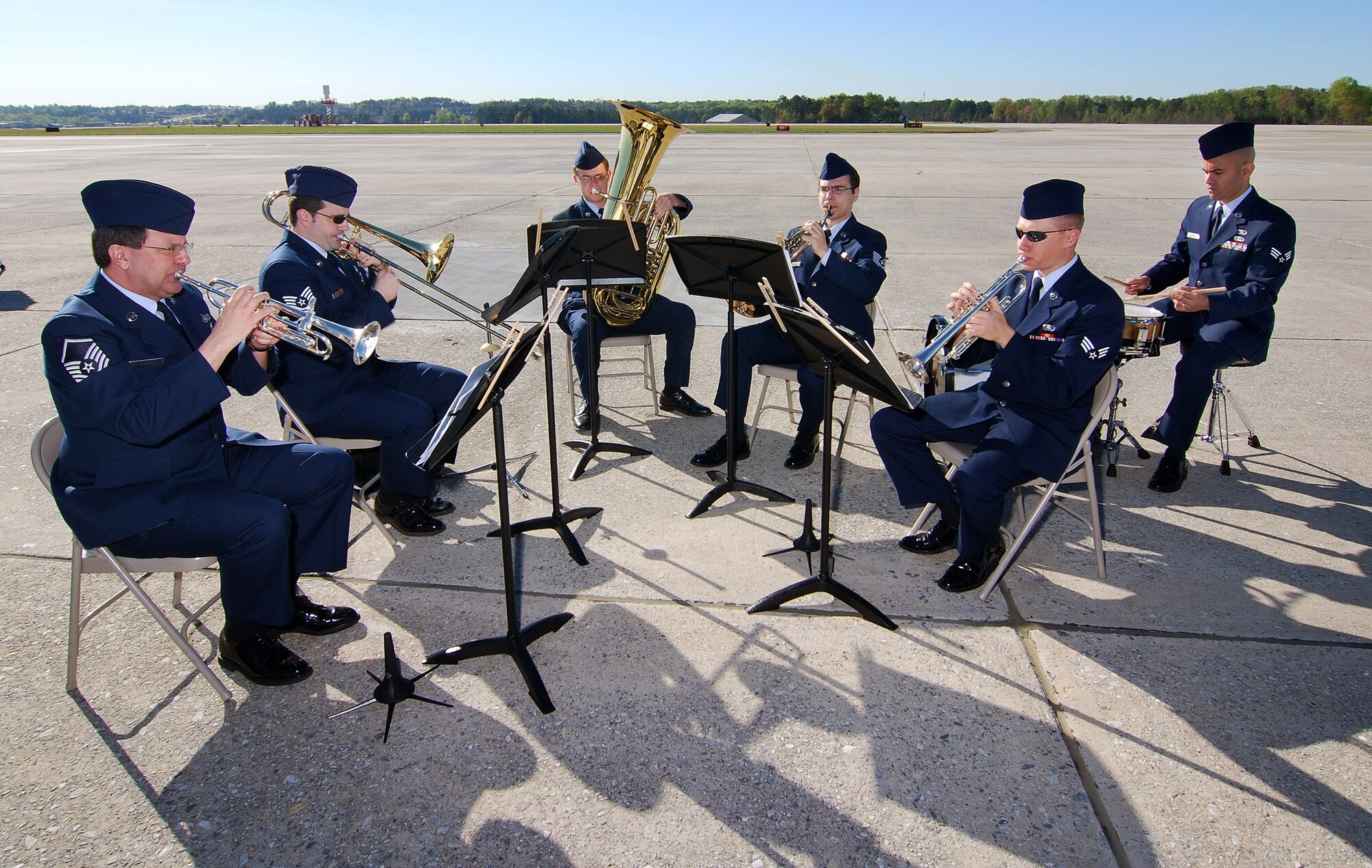 Members of the Air National Guard Band of the South, play a musical selection leading up to the start of the 94th Airlift Wing Command Chief, Chief Master Sgt. John M. Anderson's retirement ceremony, Apr 3.  Chief Anderson retires after 33 years of active and reserve Air Force duty.   (U.S. Air Force photo/ Brad Fallin)