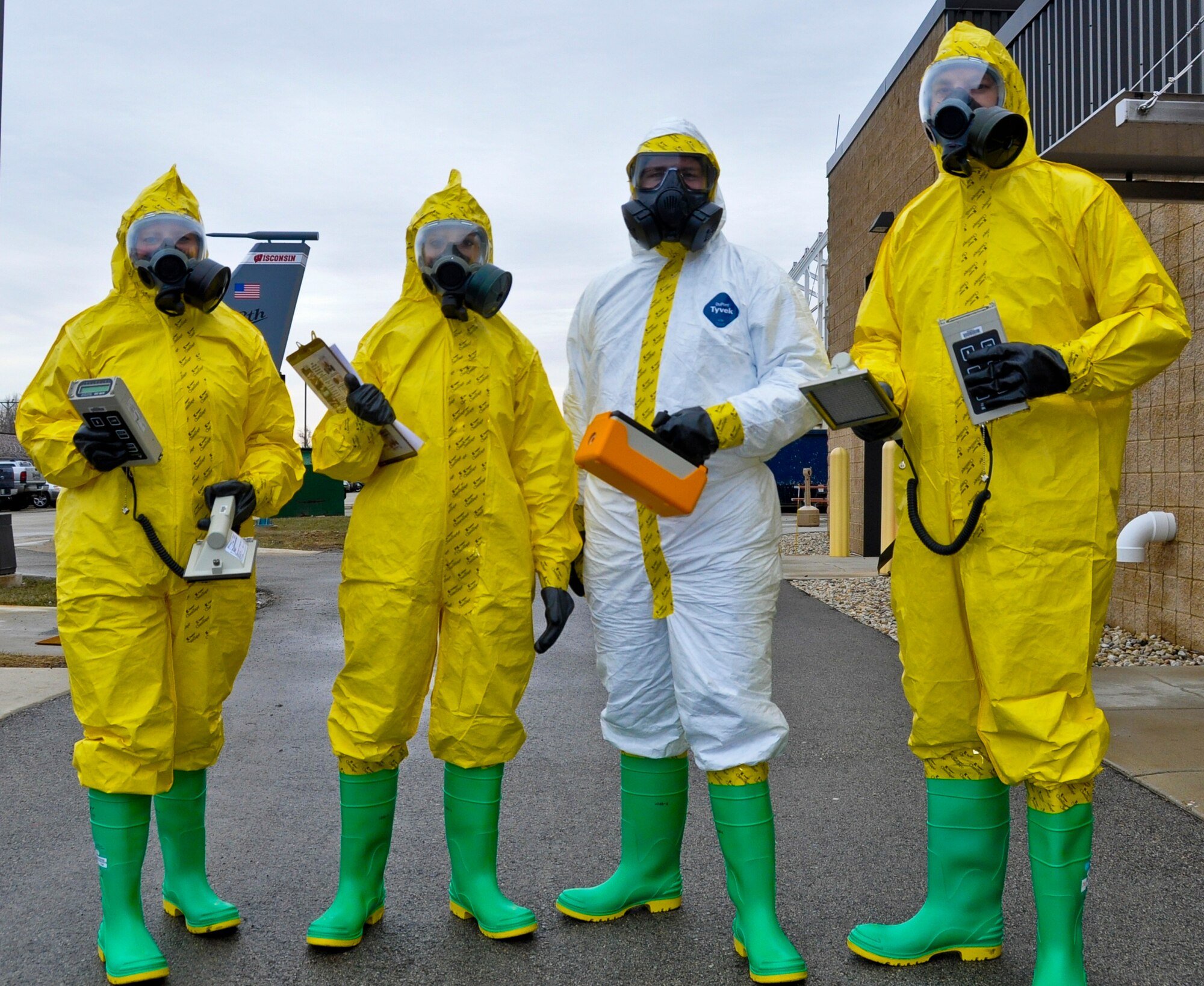 Members from the 128th Air Refueling Wing Civil Engineering Squadron's emergency management office and bio-environmental shop prepare for a radiological exercise involving a KC-135R Stratotanker at Gen. Mitchell International Airport on Sunday, April 3, 2011. From left to right, the Airmen are: Senior Airman Emily Deschand, Capt. Becky Severson, Staff Sgt. Nathan Thrun, and Staff Sgt. Jacob Kowalski. U.S. Air Force photo by Staff Sgt. Jeremy Wilson / Released
