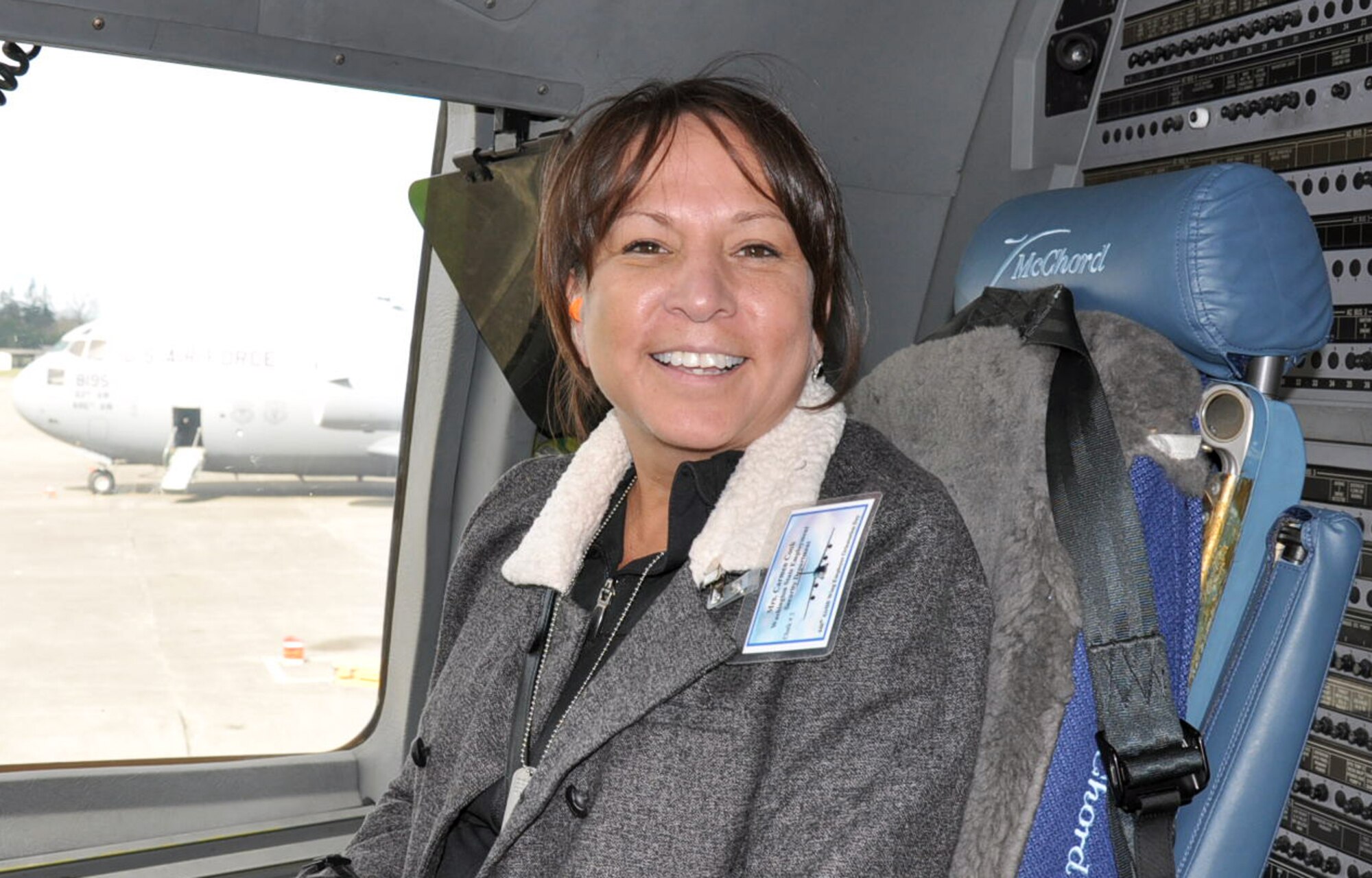"It was amazing," said Carmen Cook, a director with the Washington State Employment Security Department during the 446th Airlift Wing's Employer Orientation Day here, April 2.   Ms. Cook was one of the lucky civilian employers who had the opportunity to take a seat on the flight deck aboard a C-17 Globemaster III for an orientation flight. Civilian employers from throughout the Northwest participated in the bi-annual event which gives them a glimpse into the Reservist's mission to train and fight. (U.S. Air Force photo by Staff Sgt. Elizabeth Moody)