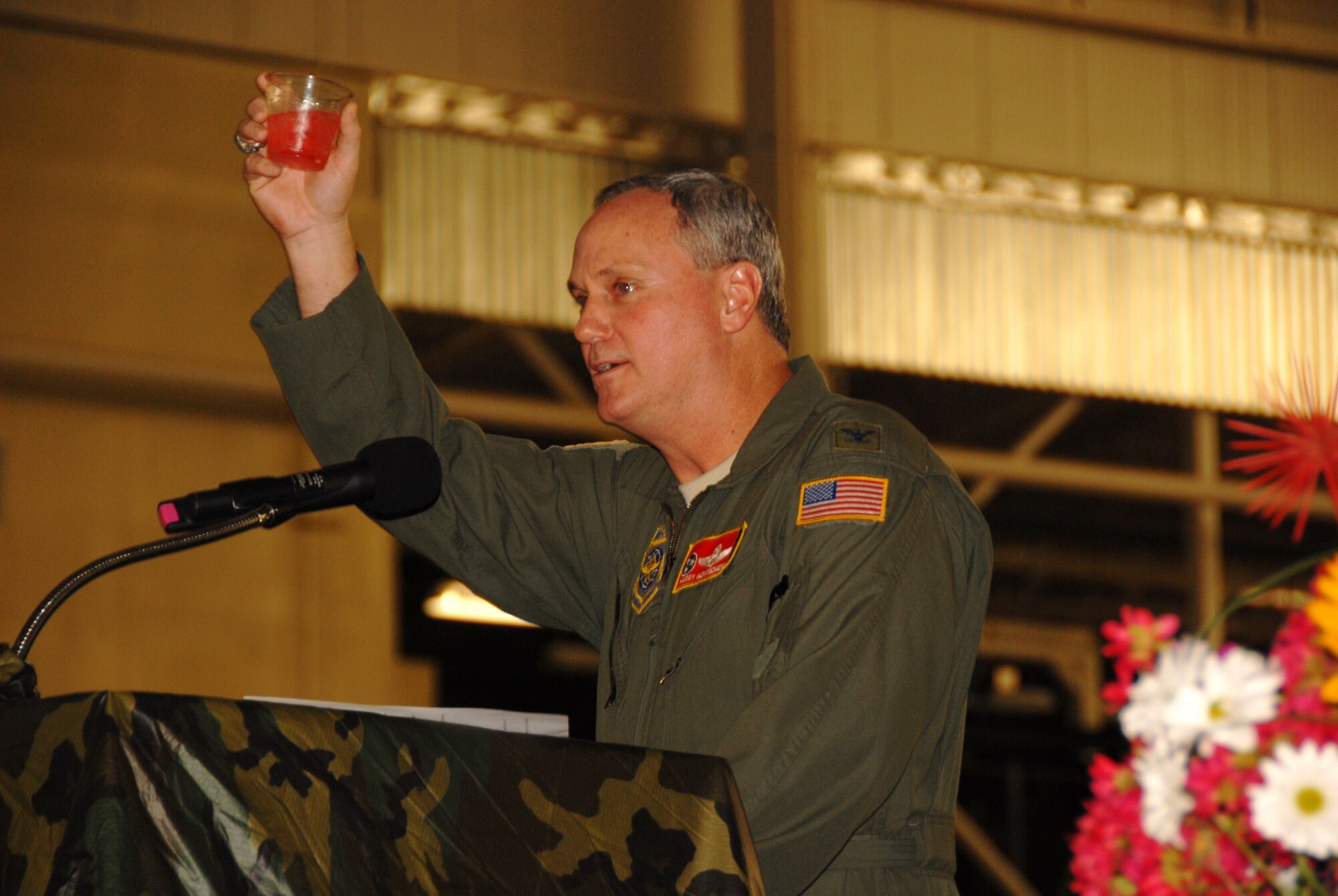 Colonel Harry D. Montgomery, Commander of the 164th Airlift Wing, raises a toast during the Combat Dining-In