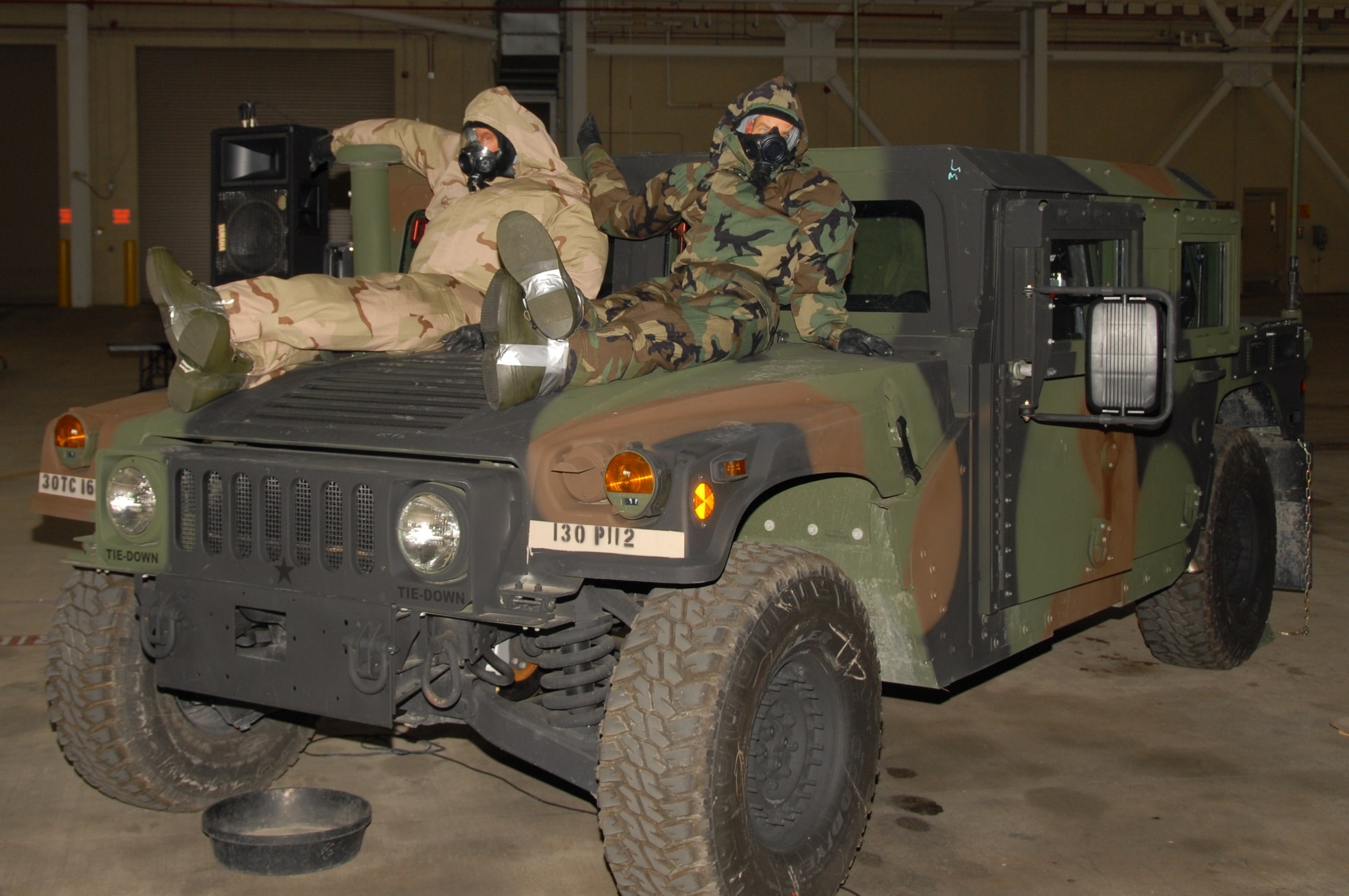 A Humvee and two dummy airmen dressed in chemical gear set the mood for the 164th Airlift Wing's Combat Dining-In