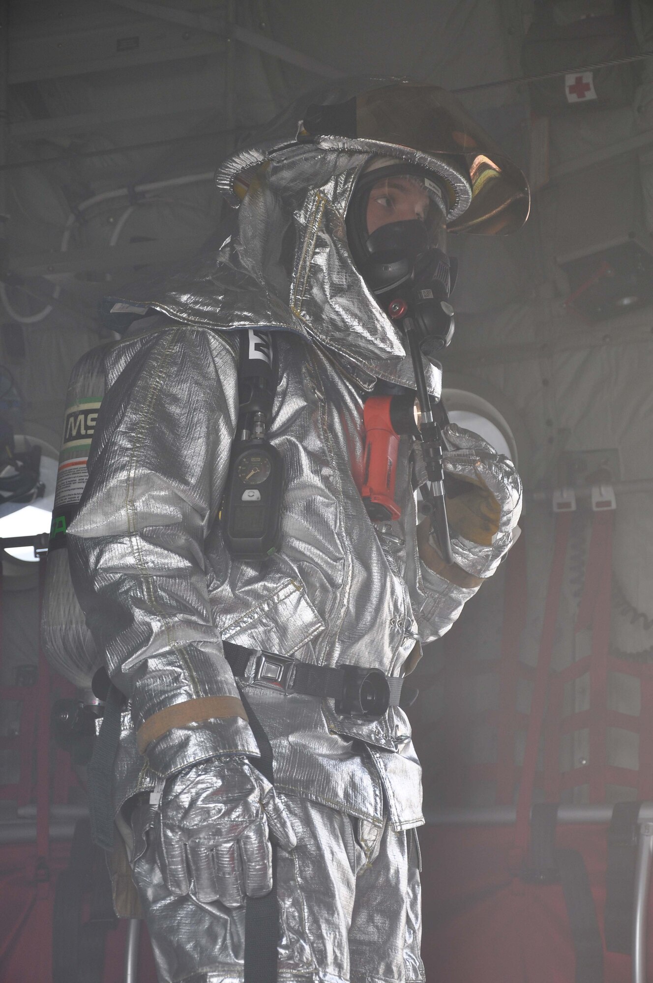 A firefighter from the 934th Airlift Wing, responds during a simulated C-130 Hercules fire April 3 2011. (Air Force Photo/TSgt Bob Sommer)