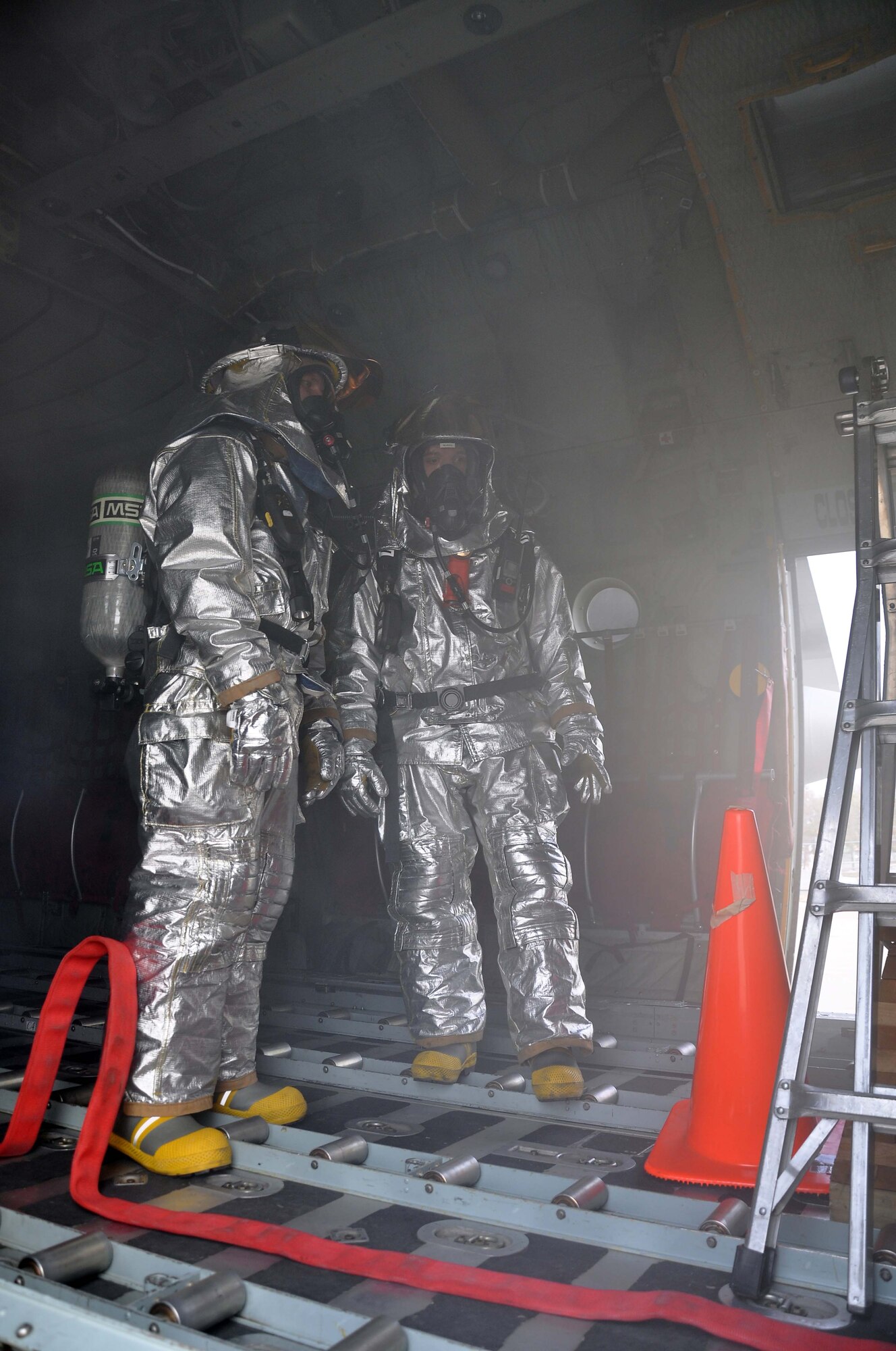 Firefighters from the 934th Airlift Wing, respond to a simulated C-130 Hercules fire April 3 2011. (Air Force Photo/TSgt Bob Sommer)