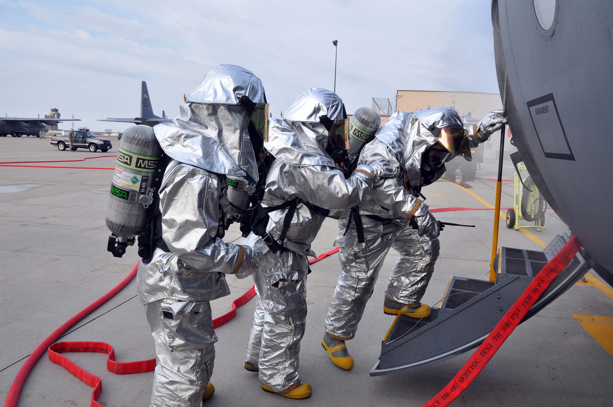 Firefighters from the 934th Airlift Wing, respond to a simulated C-130 Hercules fire April 3 2011. (Air Force Photo/TSgt Bob Sommer)