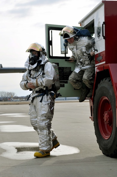 Firefighters from the 934th Airlift Wing, respond during a simulated C-130 Hercules fire April 3 2011. (Air Force Photo/TSgt Bob Sommer)