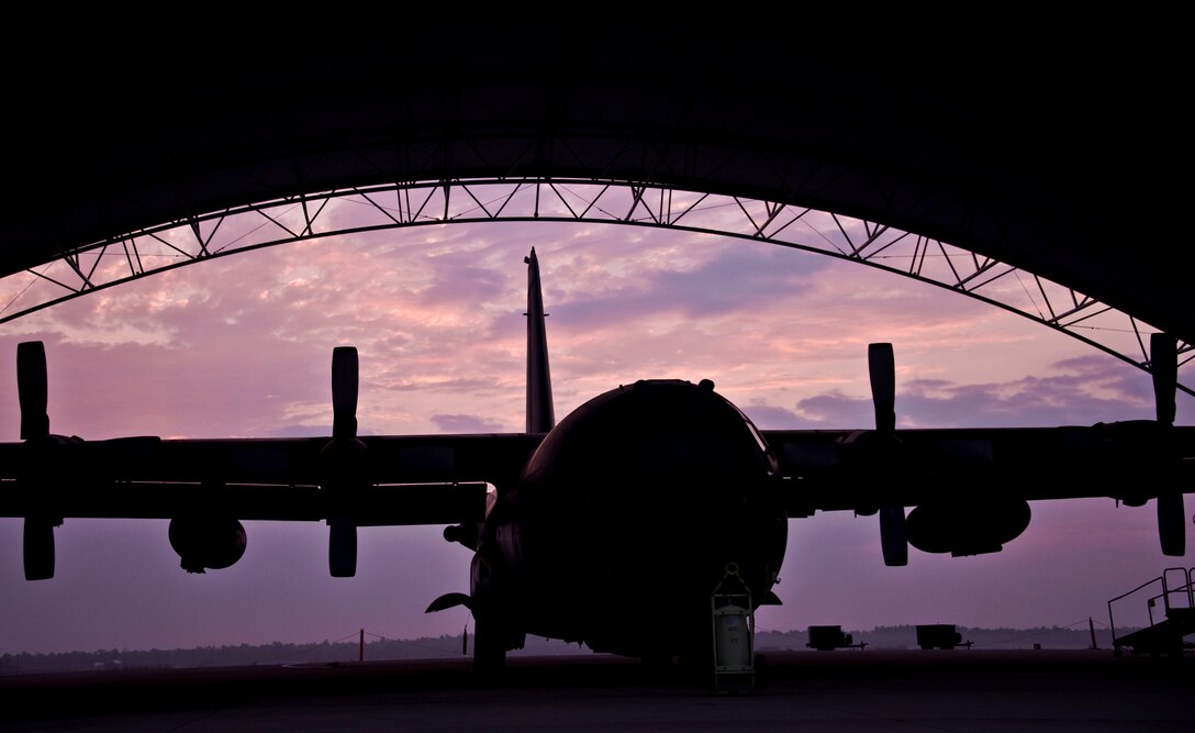 Day breaks on behind a 919th Special Operations Wing MC-130E Combat Talon April 2 at Duke Field.  The wing provides and maintains the Combat Talon special operations aircraft designed for covert operations. (U.S. Air Force photo/Tech. Sgt. Samuel King Jr.)