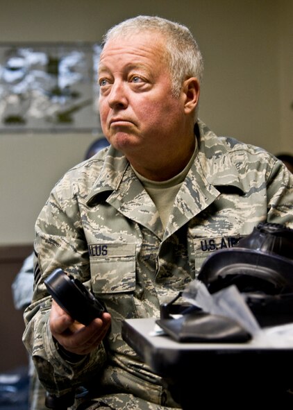 Master Sgt. Eric Halus, 919th Force Support Squadron, listens on how to disassemble the M-50 gas mask during a familiarization class during the 919th Special Operations Wing’s first four-day training weekend.  Training classes, such as gas mask, self-aid and buddy care and law of armed conflict were offered April 1 to ensure Airmen were able to accomplish as much training as possible.  (U.S. Air Force photo/Tech. Sgt. Samuel King Jr.)