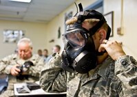 Tech. Sgt. Cecil Guy, 919th Force Support Squadron, dons the M-50 gas mask at a familiarization class during the 919th Special Operations Wing’s first four-day training weekend.  Training classes, such as gas mask, self-aid and buddy care and law of armed conflict, were offered April 1 to ensure Airmen were able to accomplish as much training as possible.  (U.S. Air Force photo/Tech. Sgt. Samuel King Jr.)