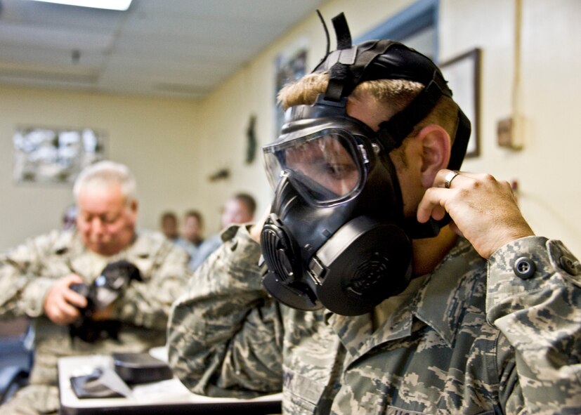 Tech. Sgt. Cecil Guy, 919th Force Support Squadron, dons the M-50 gas mask at a familiarization class during the 919th Special Operations Wing’s first four-day training weekend.  Training classes, such as gas mask, self-aid and buddy care and law of armed conflict, were offered April 1 to ensure Airmen were able to accomplish as much training as possible.  (U.S. Air Force photo/Tech. Sgt. Samuel King Jr.)