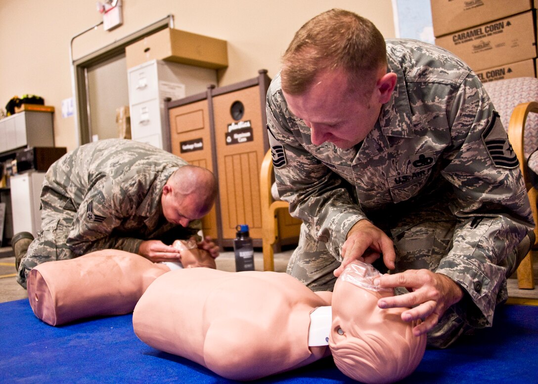 A senior NCO and NCO practice CPR techniques during the 919th Special Operations Wing’s first four-day training weekend.  Training classes, such as gas mask, self-aid and buddy care and law of armed conflict were offered April 1 to ensure Airmen were able to accomplish as much training as possible.  (U.S. Air Force photo/Tech. Sgt. Samuel King Jr.)