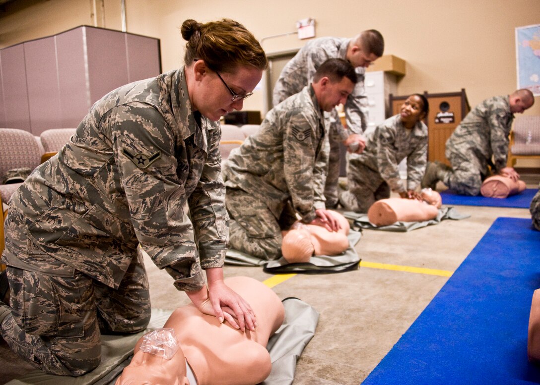 Airman Tonya Volpi, 919th Aircraft Maintenance Squadron, and other reservists practice CPR techniques during the 919th Special Operations Wing’s first four-day training weekend.  Training classes, such as gas mask, self-aid and buddy care and law of armed conflict were offered April 1 to ensure Airmen were able to accomplish as much training as possible.  (U.S. Air Force photo/Tech. Sgt. Samuel King Jr.)