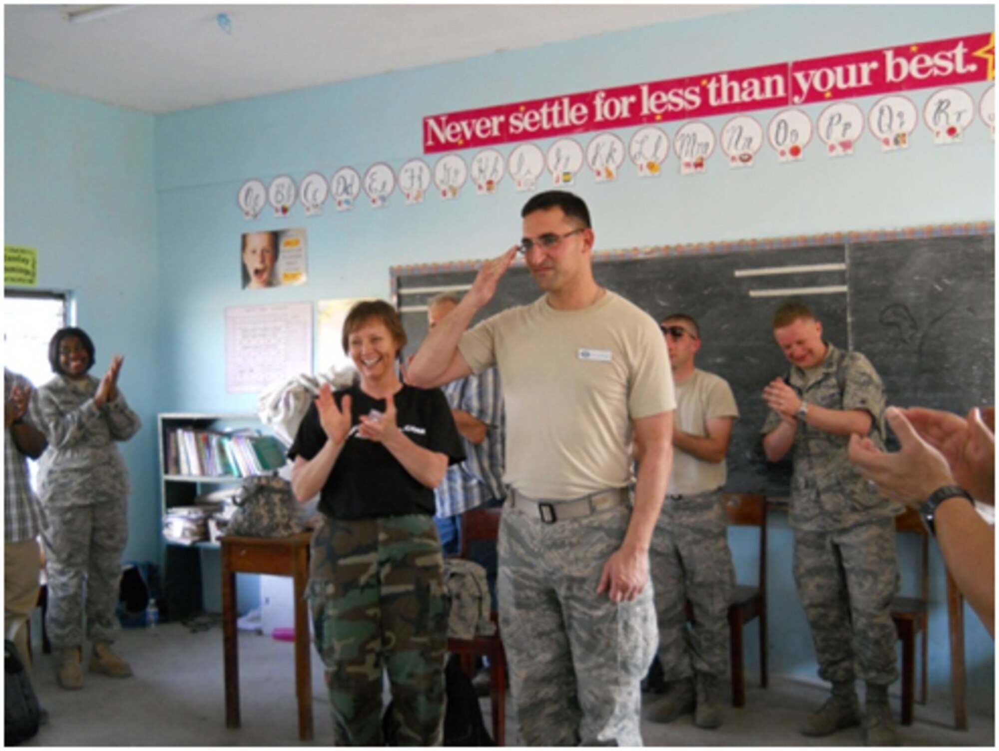 Captain Vincent Chiappone, 940 AMDF dental officer, was selected for promotion to major while on humanitarian deployment to Belize, Mar. 30.  Chiappone and two other 940 AMDF Reservists, Major Michael Dailey and Staff Sgt. Karie Covey, are part of a 34-person medical team that deployed Mar. 25.  The medical readiness training mission, dubbed Medrete 2011, is offering dental, medical and optometry services to nearly 500 patients a day in rural villages there. (Courtesy photo)