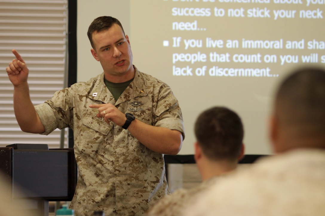 Navy Lt. Mathew Riley, chaplain, School of Infantry-West speaks to service members during a sexual assault prevention symposium, April 4, at the San Luis Rey Marine Corps Family Team Building to raise awareness of sexual assault. The symposium dubbed “Men of Valor” was geared toward informing male service members of the significance of ending violence and discrimination against women and to create an increased awareness of bystander intervention.