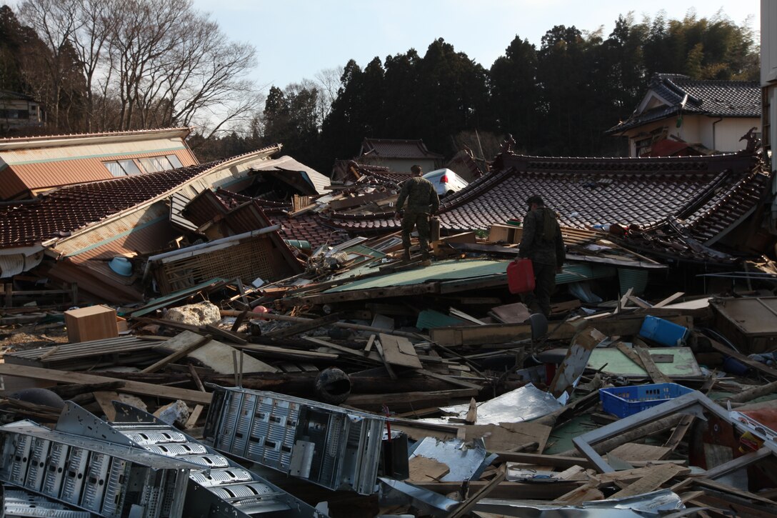 Marines with Battalion Landing Team 2nd Battalion, 5th Marines, 31st Marine Expeditionary Unit, walk over rubble and debris during a humanitarian assistance/disaster relief mission at Uranohama Port, April 1. The mission was in support of Operation Tomodachi.  The 31st MEU's involvement is part of a larger U.S. government response, after a 9.0 earthquake and subsequent tsunami struck Japan causing widespread damage.  The 31st MEU is ready to support our Japanese partners and to provide assistance when called upon.