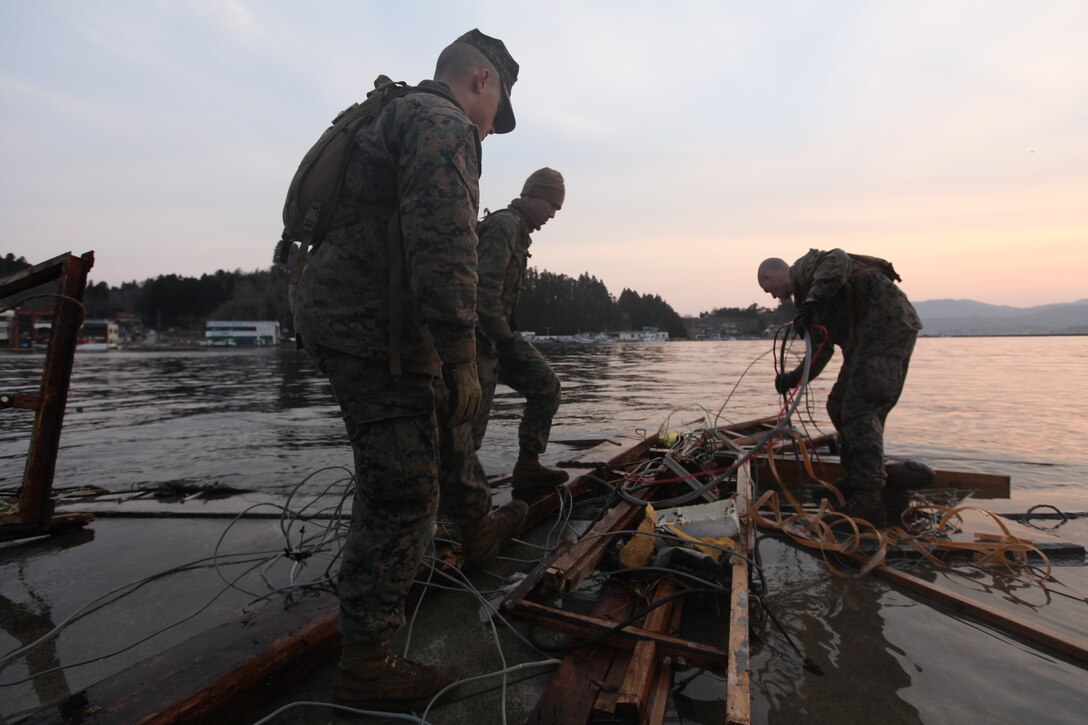 Marines with Battalion Landing Team 2nd Battalion, 5th Marines, 31st Marine Expeditionary Unit, pick-up debris near the water during a humanitarian assistance/disaster relief mission at Uranohama Port, April 1. The mission was in support of Operation Tomodachi.  The 31st MEU's involvement is part of a larger U.S. government response, after a 9.0 earthquake and subsequent tsunami struck Japan causing widespread damage.  The 31st MEU is ready to support our Japanese partners and to provide assistance when called upon.