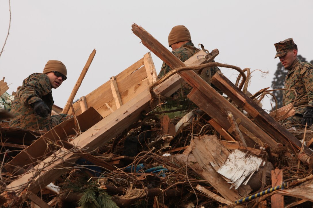 Marines with Battalion Landing Team 2nd Battalion, 5th Marines, Battalion Landing Team, 31st Marine Expeditionary Unit, pick-up debris during a humanitarian assistance/disaster relief mission at Uranohama Port, April 2. The mission was in support of Operation Tomodachi.  The 31st MEU's involvement is part of a larger U.S. government response, after a 9.0 earthquake and subsequent tsunami struck Japan causing widespread damage.  The 31st MEU is ready to support our Japanese partners and to provide assistance when called upon.