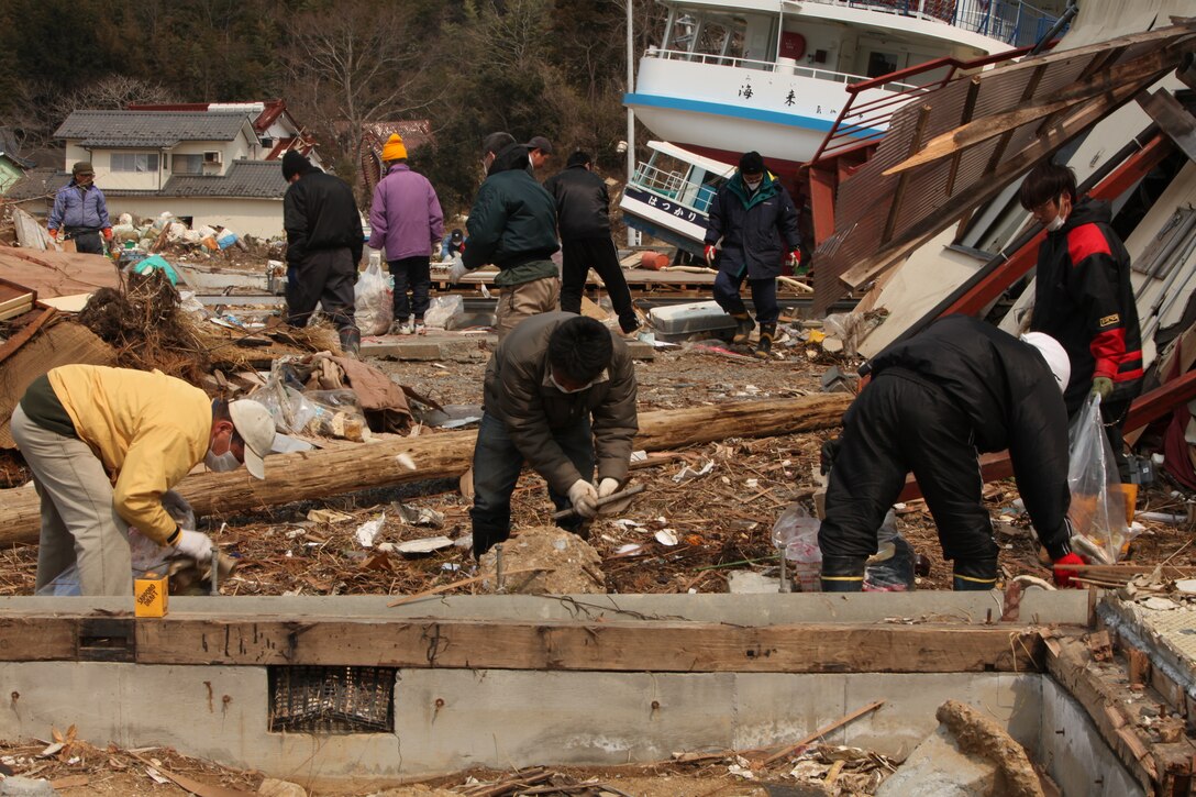 Japanese citizens pick through debris at Uranohama Port, in the aftermath of the earthquake and subsequent tsunami that struck the region.  The 31st MEU's involvement in Operation Tomodachi is part of a larger U.S. government response, after a 9.0 earthquake and subsequent tsunami struck Japan causing widespread damage.  The 31st MEU is ready to support our Japanese partners and to provide assistance when called upon.