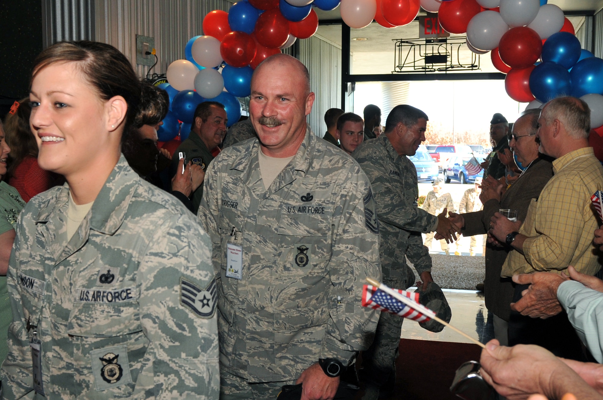 Members of Team Little Rock who recently returned from deployments are greeted by friends and family at the Welcome Home Warriors event April 1, 2011, at Little Rock Air Force Base, Ark. The Welcome Home Warriors event is designed to recognize individual deployers who returned home through Little Rock National Airport and were not part of a large group returning to the base. (U.S. Air Force photo by Airman 1st Class Rusty Frank)