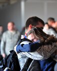 MINOT AIR FORCE BASE, N.D. -- Airmen are greeted in a grand fashion by their families during the re-deployment here April 4. Minot’s 69th Bomb Squadron and 5th Bomb Wing personnel deployed to Andersen AFB last November in support of U.S. Pacific Command’s Continuous Bomber Presence. This was the 69th BS’ first deployment since it’s reactivation in September 2009 and the first major combat deployment of aircraft and personnel since World War II. (U.S. Air Force photo/Staff Sgt. Keith Ballard)